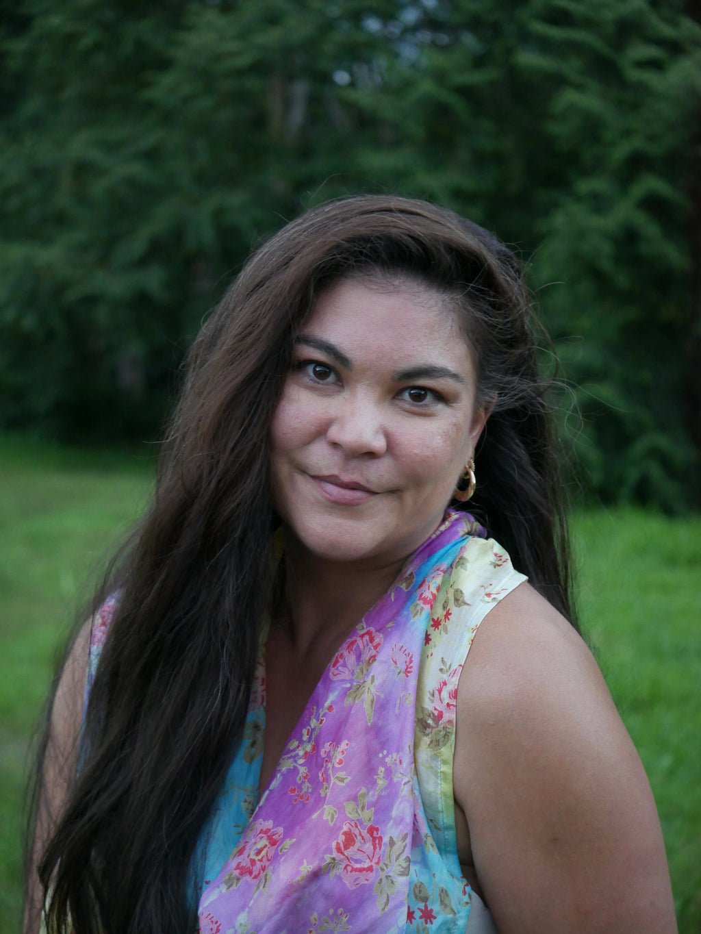 Model in a multicolored purple, blue, yellow, and gray silk scarf, photographed at Olson Keolanui Farms in Hilo.