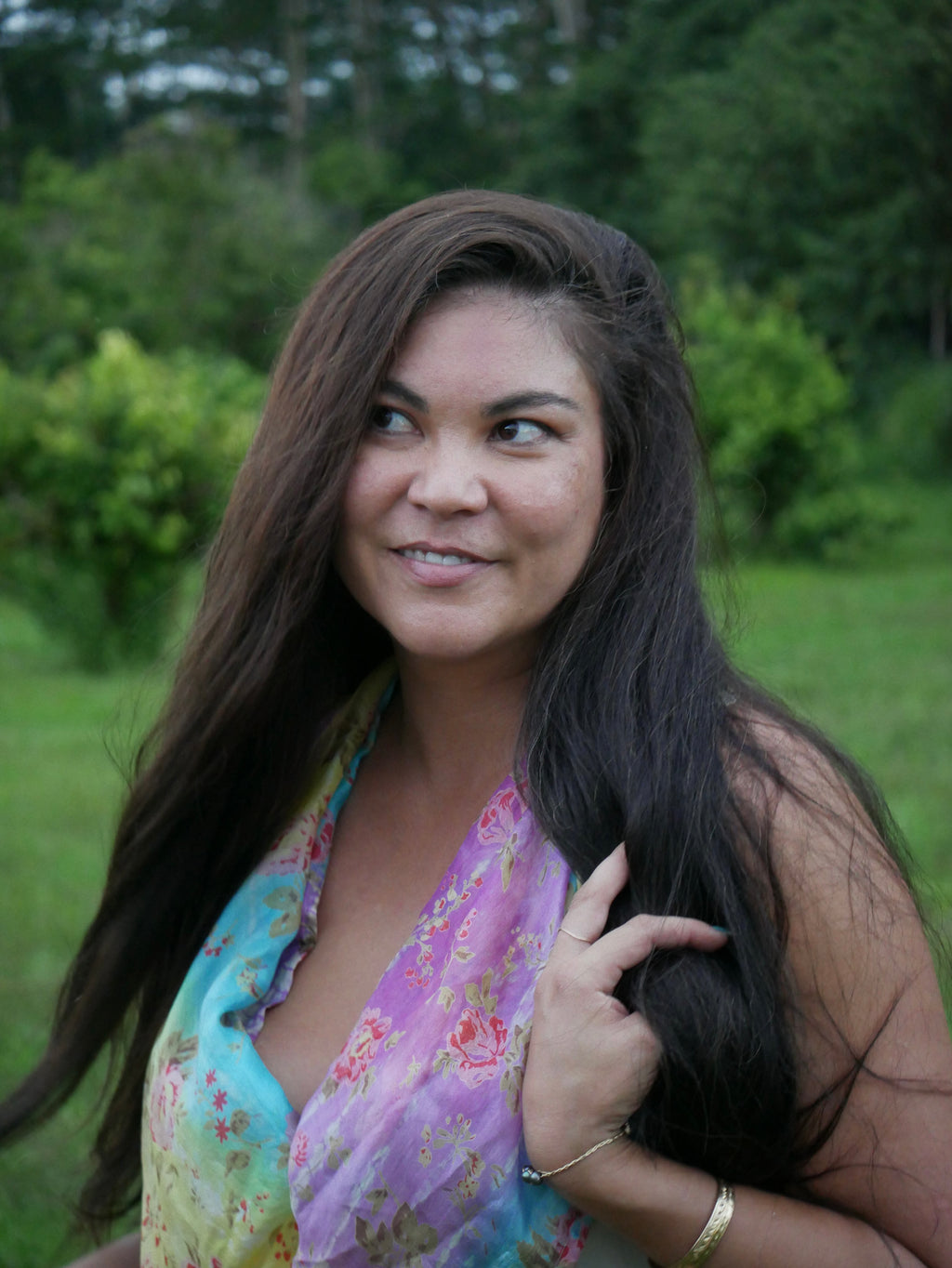 Model in a multicolored purple, blue, yellow, and gray silk scarf, photographed at Olson Keolanui Farms in Hilo.